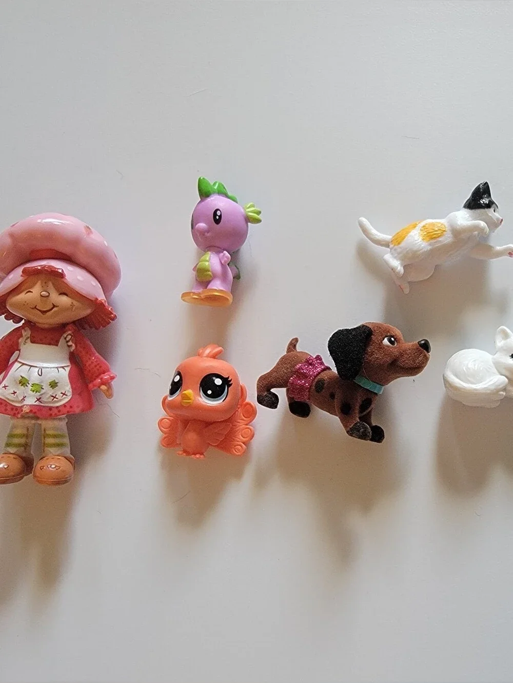 Mini Figurine Lot — Strawberry Doll, Barbie Pets, Peacock, Sleeping Cat, Axolotl